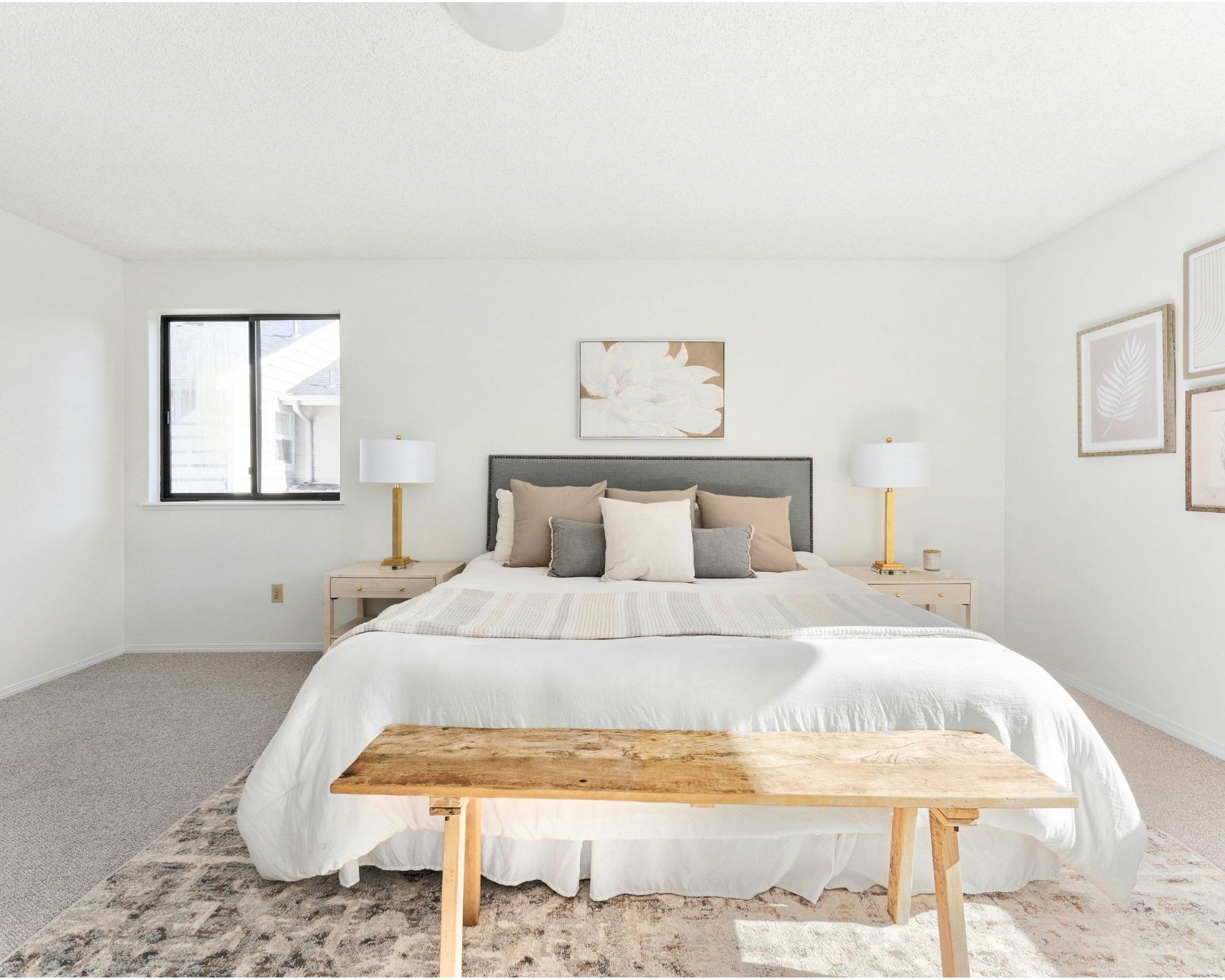 Staged vacation rental bedroom with fresh white linens, ready for guest turnover
